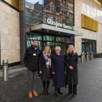 Marion Fellows MP with ScotRail CEO Joanne Maguire and other ScotRail staff, outside Glasgow Queen Street station.