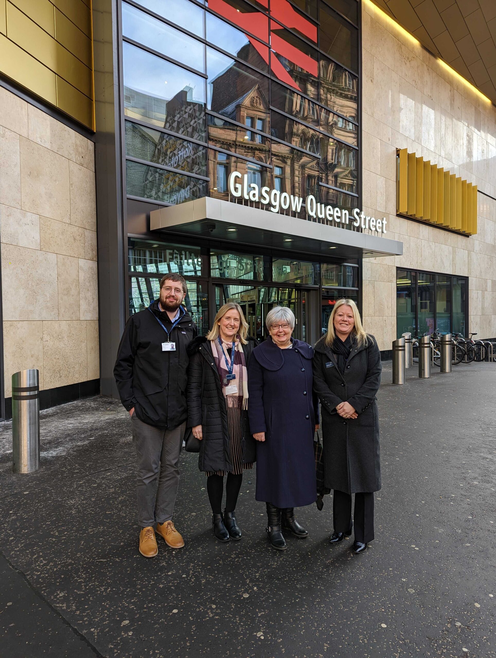 Marion Fellows MP with ScotRail CEO Joanne Maguire and other ScotRail staff, outside Glasgow Queen Street station.